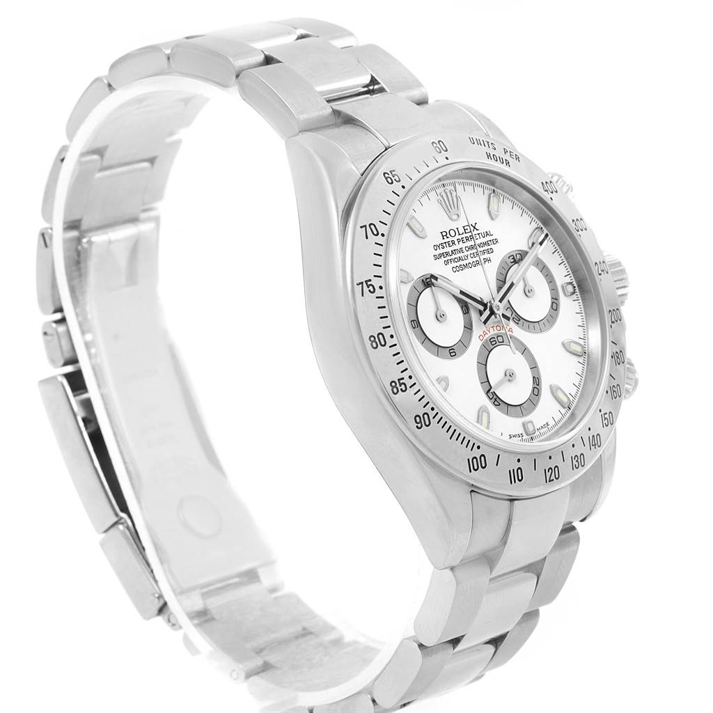 The image shows a Rolex Daytona 116520 Men
s Stainless Steel White Dial 116520 Men
s Stainless Steel White Dial watch from a side angle, highlighting its dial, bezel, and bracelet.