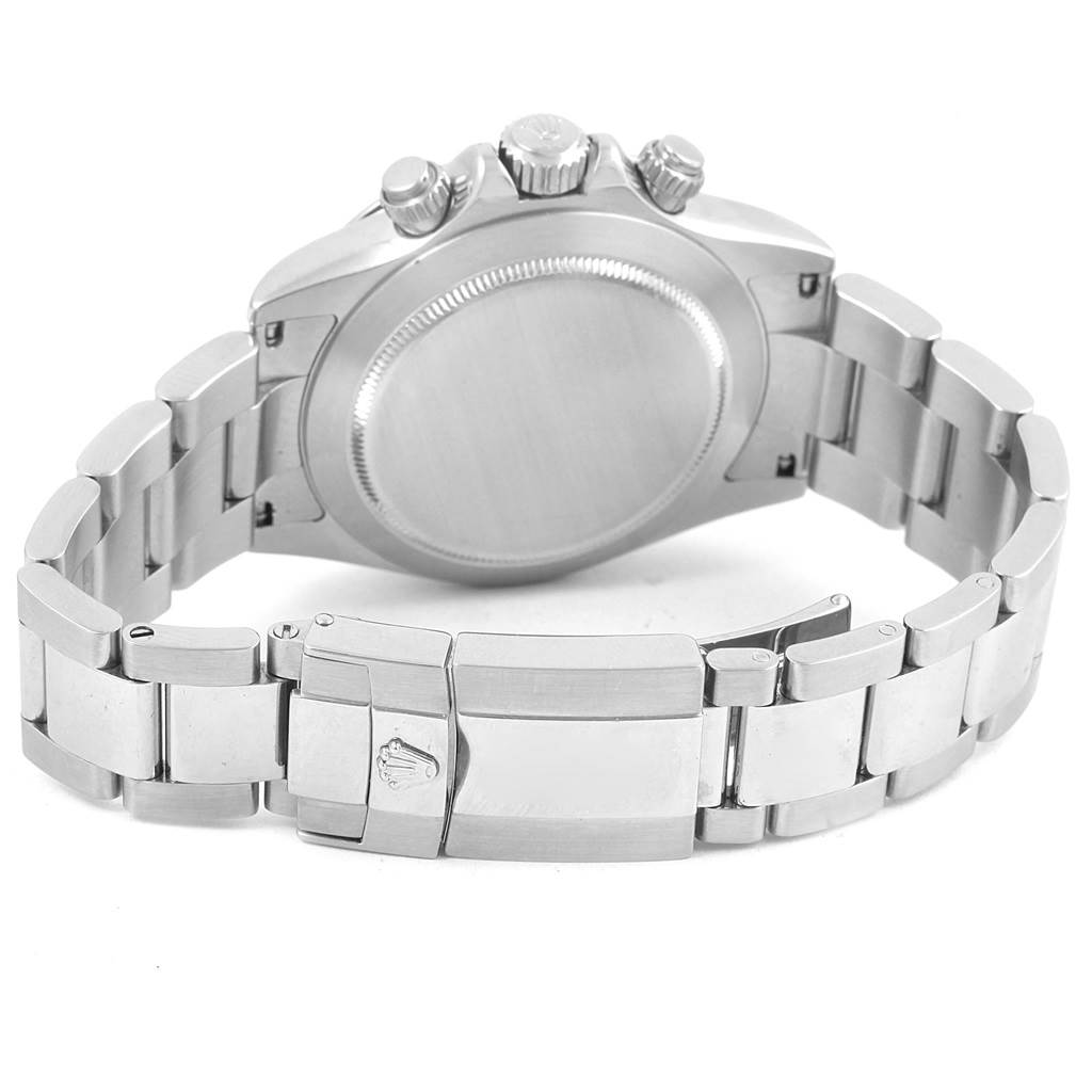 This image shows the backside of the Rolex Daytona 116520 Men
s Stainless Steel White Dial 116520 Men
s Stainless Steel White Dial watch and its metal bracelet, including the clasp and case back.