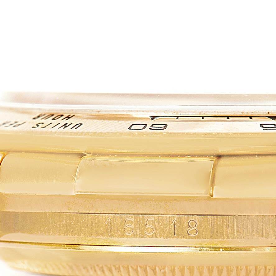 This image shows a close-up side view of the bezel and case edge of a Rolex Daytona 16518 Men's Yellow Gold White Dial 16518 Men's Yellow Gold White Dial watch, highlighting its model number.
