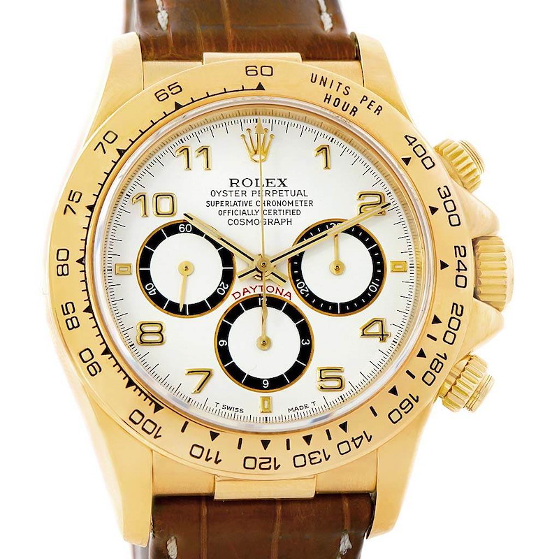 The image displays a front view of a Rolex Daytona watch with a gold case and brown leather strap.