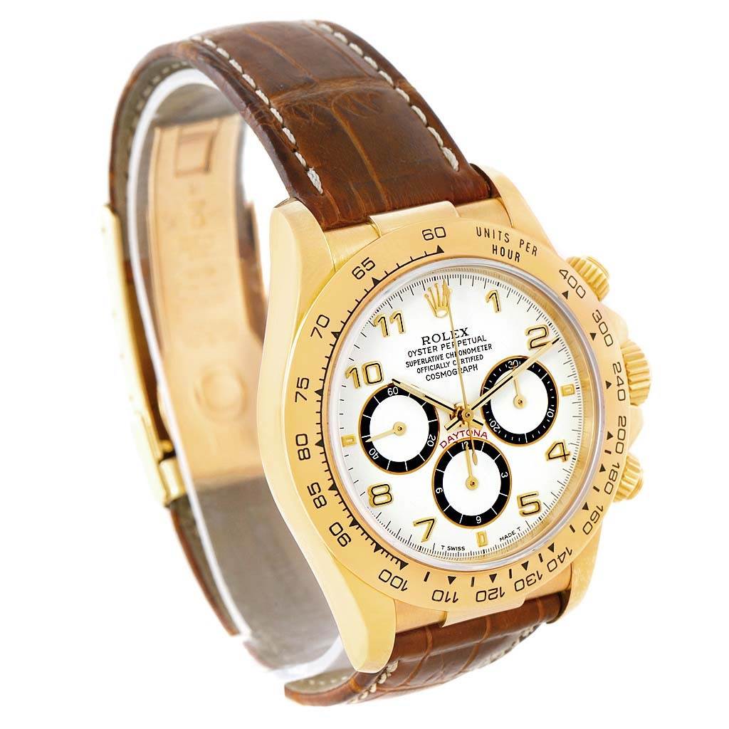 The image shows a Rolex Daytona 16518 Men's Yellow Gold White Dial 16518 Men's Yellow Gold White Dial watch at a slight angle, highlighting its gold case, white dial, chronograph subdials, and brown leather strap.