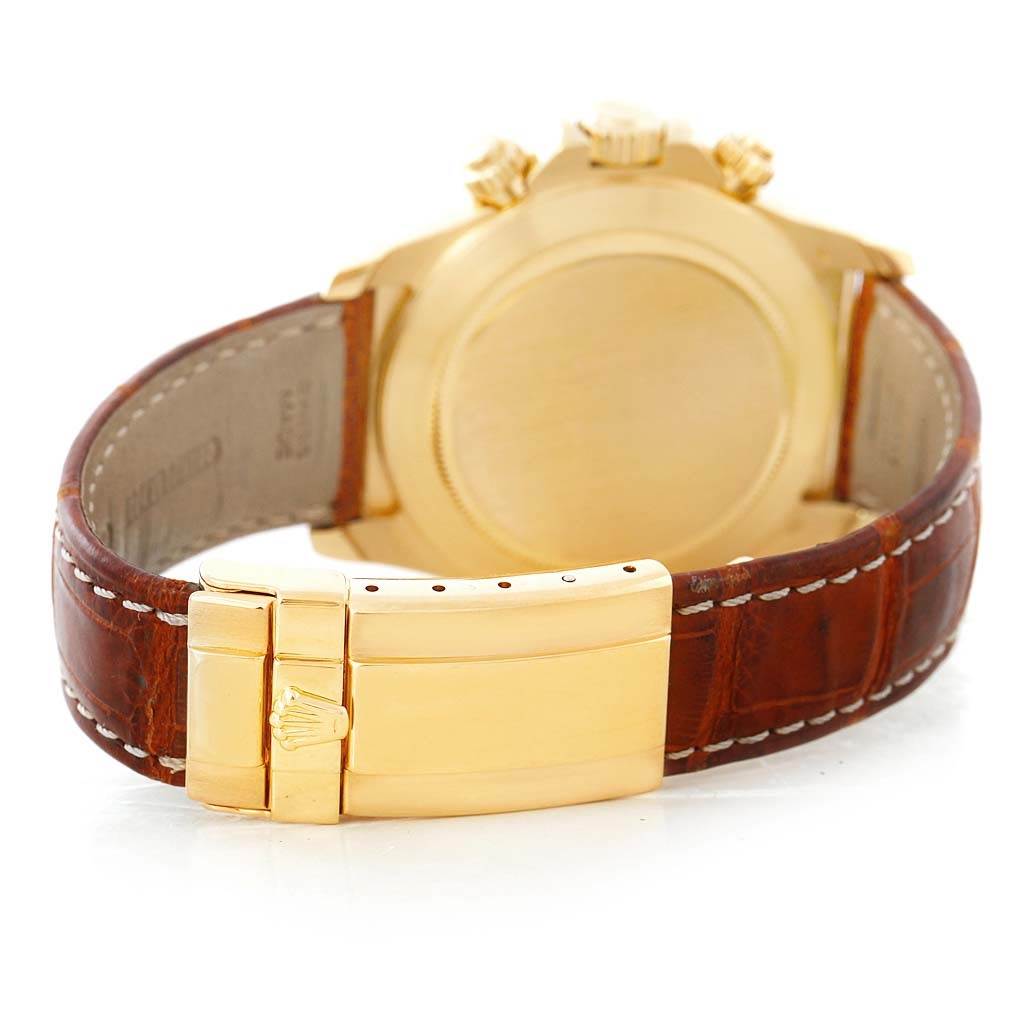 The image shows the back view of a Rolex Daytona 16518 Men's Yellow Gold White Dial 16518 Men's Yellow Gold White Dial watch with a gold case and brown leather strap.