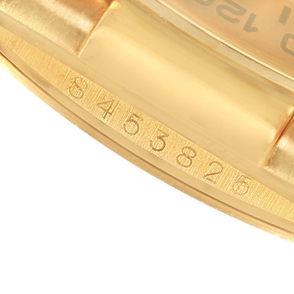 This image shows a close-up angle of the serial number engraving on the case of a Rolex Daytona 16518 Men's Yellow Gold White Dial 16518 Men's Yellow Gold White Dial watch.