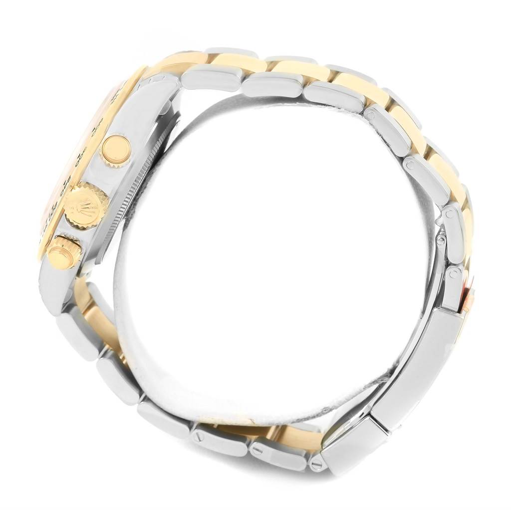 This image shows a side view of the Rolex Daytona 116503 Men's Steel and Gold (two tone) White Dial 116503 Men's Steel and Gold (two tone) White Dial watch, highlighting the bracelet and side buttons.