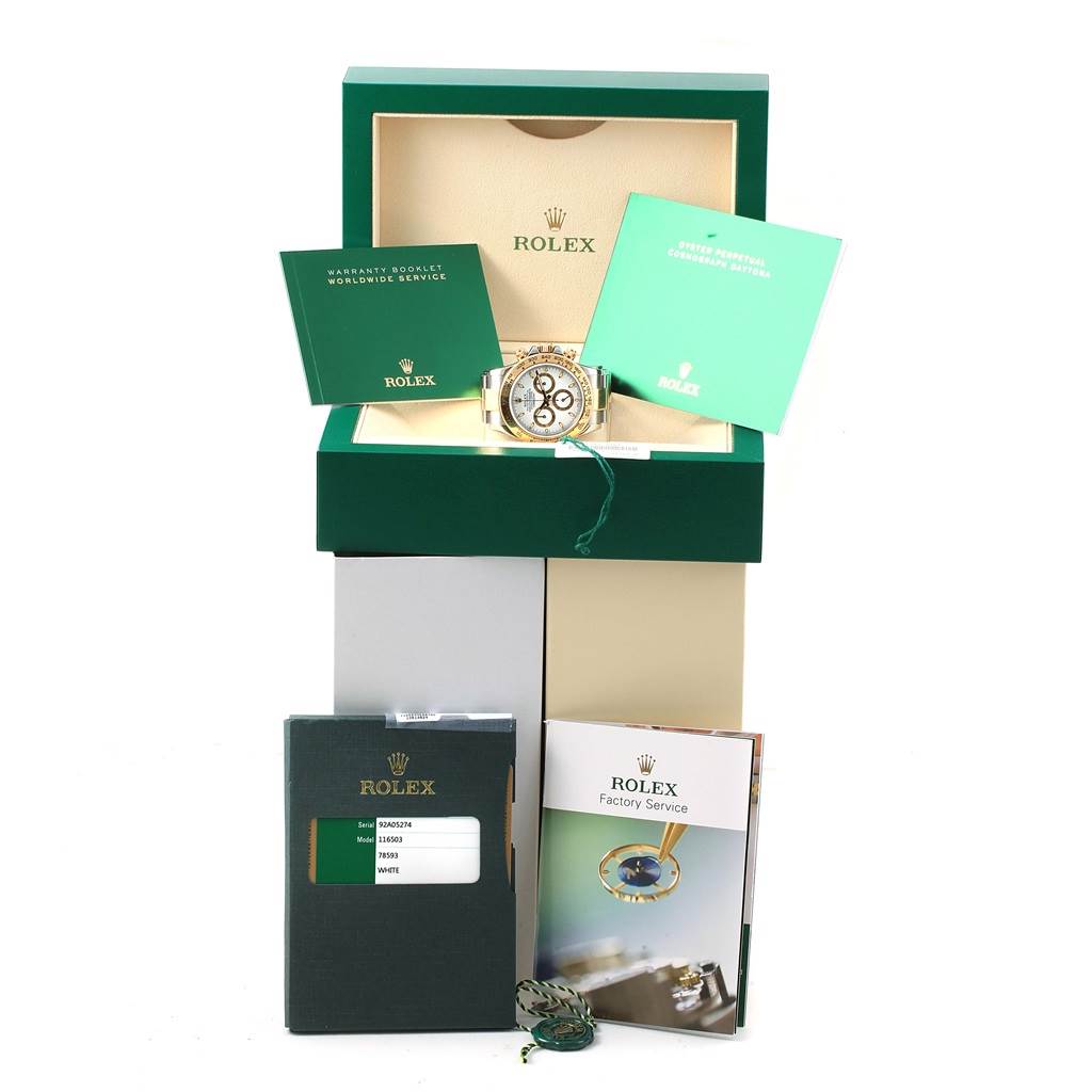 The image shows a Rolex Daytona 116503 Men's Steel and Gold (two tone) White Dial 116503 Men's Steel and Gold (two tone) White Dial watch in its opened box, with accompanying booklets and tags.