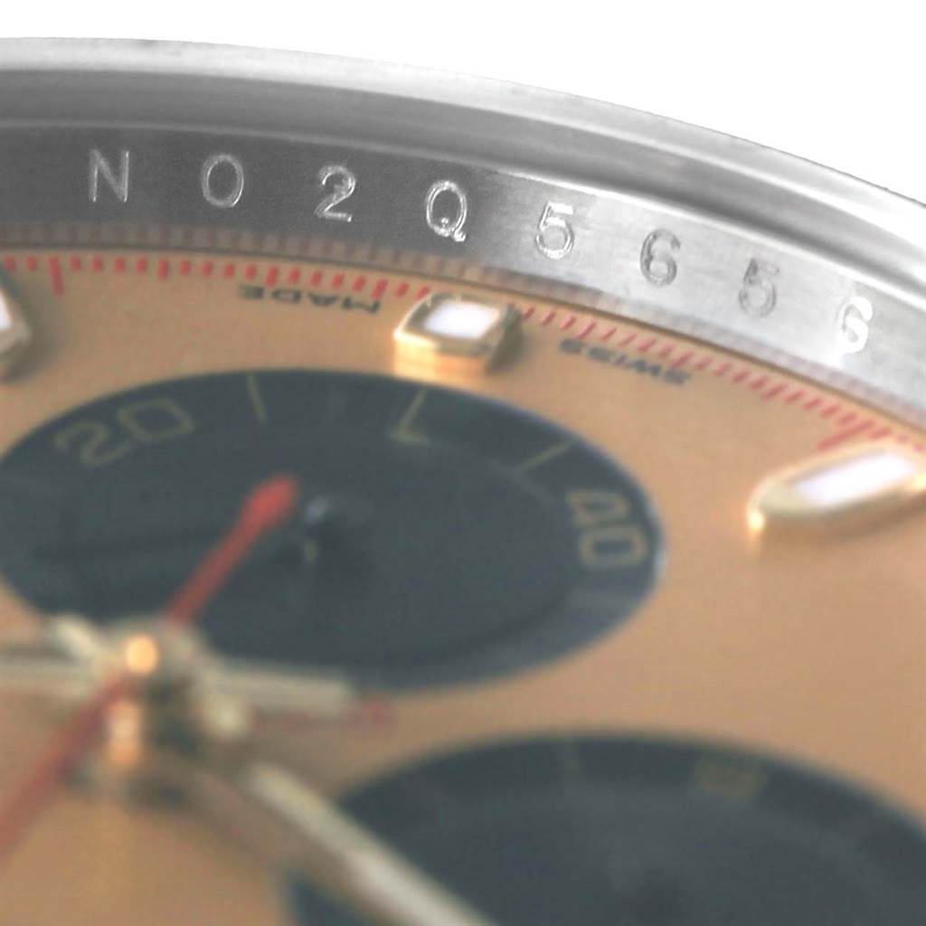 This close-up of the Rolex Daytona 116523 Men's Steel and Gold (two tone) Champagne Dial 116523 Men's Steel and Gold (two tone) Champagne Dial shows the watch face, sub-dials, and partial bezel with engraved numbers.