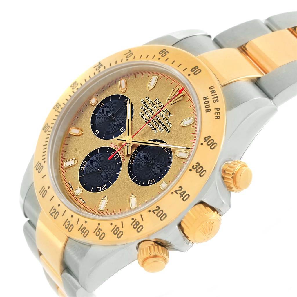 The image shows a close-up angle of the Rolex Daytona 116523 Men's Steel and Gold (two tone) Champagne Dial 116523 Men's Steel and Gold (two tone) Champagne Dial watch, highlighting its gold bezel, dial, chronograph subdials, and crown.