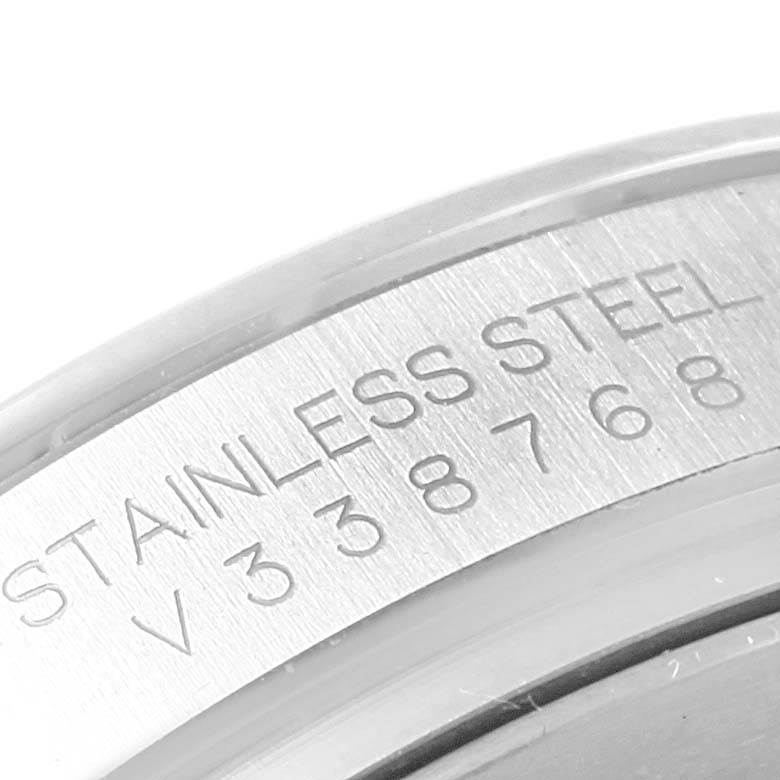 This close-up image shows the serial number and "Stainless Steel" marking on the case back of a Rolex Daytona 116520 Men's Stainless Steel White Dial 116520 Men's Stainless Steel White Dial watch.