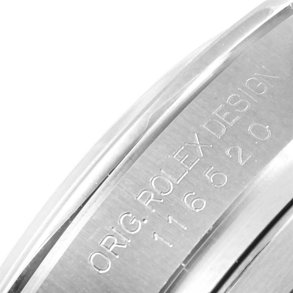 The image shows a close-up of the engraved side of a Rolex Daytona 116520 Men's Stainless Steel White Dial 116520 Men's Stainless Steel White Dial watch, highlighting the model number and "ROLEX DESIGN" text.