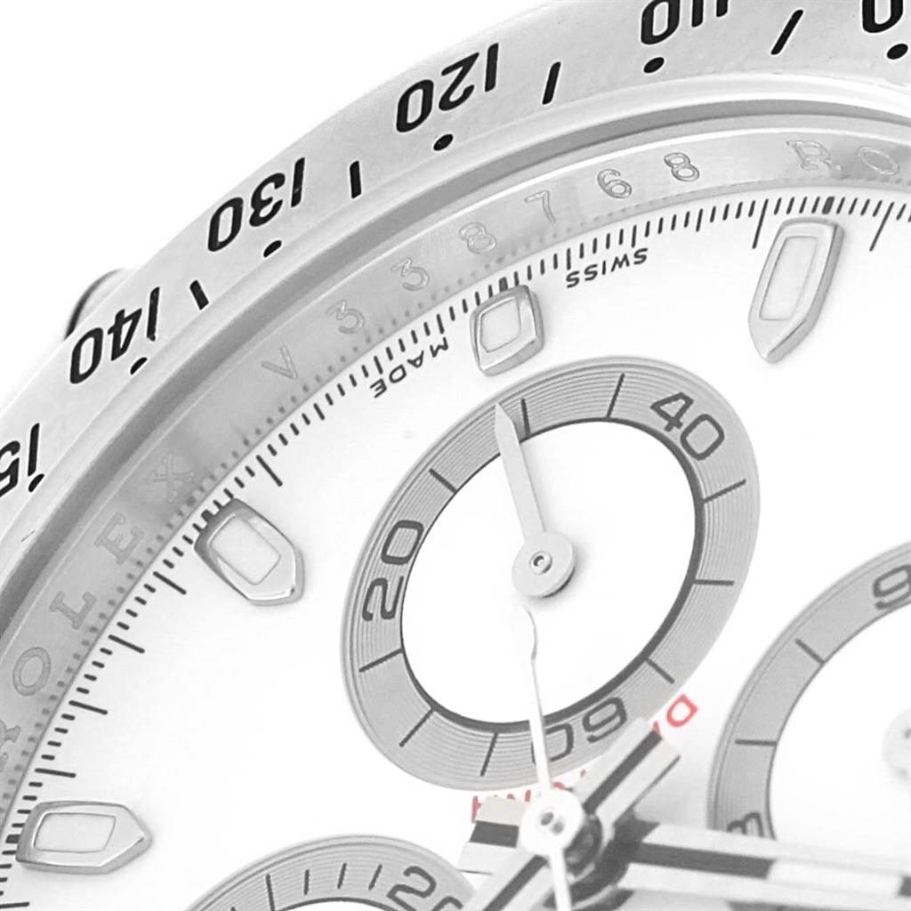 The image shows a close-up of the dial and bezel of a Rolex Daytona 116520 Men's Stainless Steel White Dial 116520 Men's Stainless Steel White Dial watch, highlighting the sub-dials and part of the tachymeter scale.