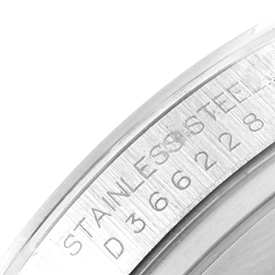 This image shows a close-up of the serial number engraving on the stainless steel casing of a Rolex Daytona 116520 Men's Stainless Steel Black Dial 116520 Men's Stainless Steel Black Dial watch.