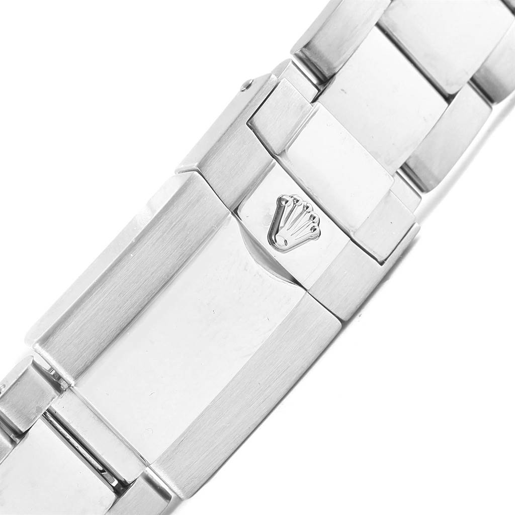 This image shows a close-up of the clasp and part of the bracelet of a Rolex Daytona 116509 Men's White Gold Blue Dial 116509 Men's White Gold Blue Dial watch.