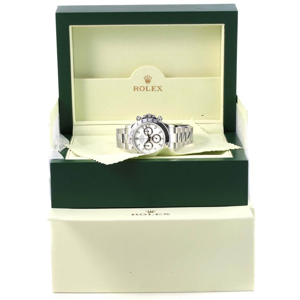 The image shows a Rolex Daytona 116520 Men's Stainless Steel White Dial 116520 Men's Stainless Steel White Dial watch in its opened green and cream-colored branded box, viewed from the front.