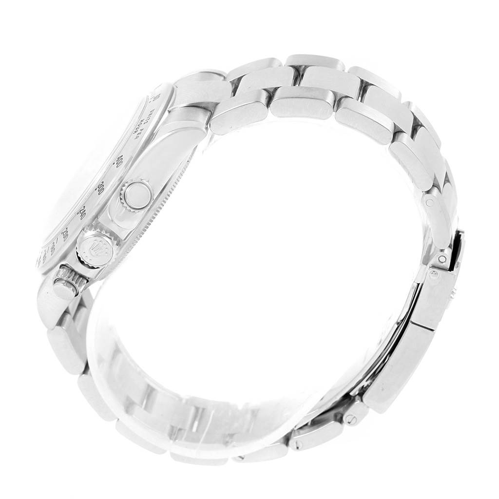 The image shows a side view of a Rolex Daytona 116520 Men's Stainless Steel White Dial 116520 Men's Stainless Steel White Dial watch, highlighting the bracelet, crown, and pushers.
