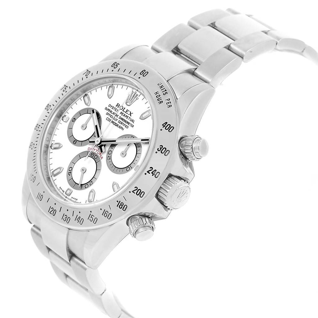 The image shows a Rolex Daytona 116520 Men's Stainless Steel White Dial 116520 Men's Stainless Steel White Dial watch from an angled side view, highlighting its dial, bezel, crown, pushers, and bracelet.