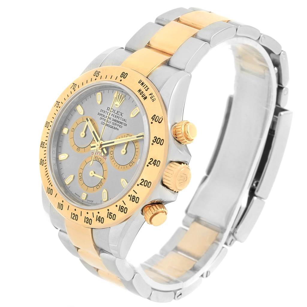 The image shows a Rolex Daytona 116523 Men's Steel and Gold (two tone) Grey Dial 116523 Men's Steel and Gold (two tone) Grey Dial watch at an angle, highlighting its face, bezel, bracelet, and chronograph pushers.