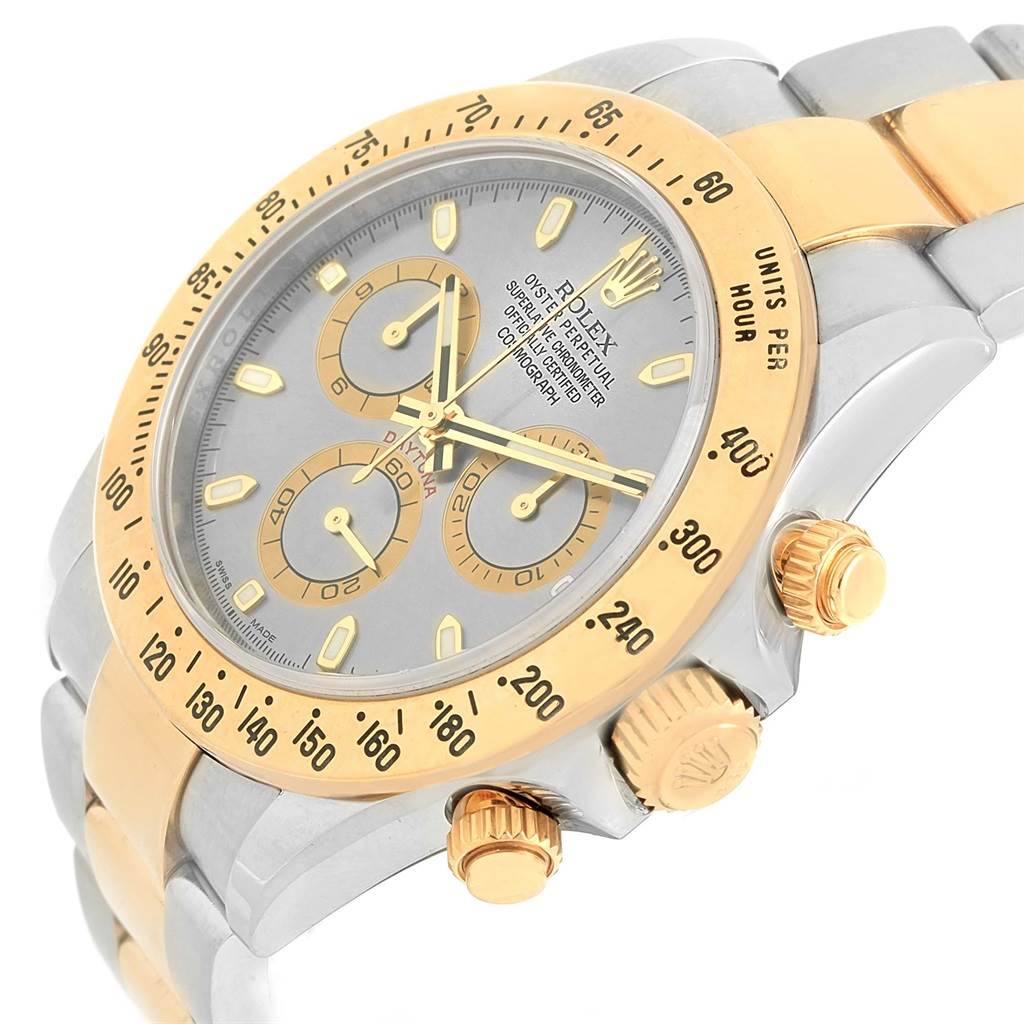 This image shows a close-up angle of the Rolex Daytona 116523 Men's Steel and Gold (two tone) Grey Dial 116523 Men's Steel and Gold (two tone) Grey Dial watch, focusing on the dial, bezel, pushers, and part of the bracelet.
