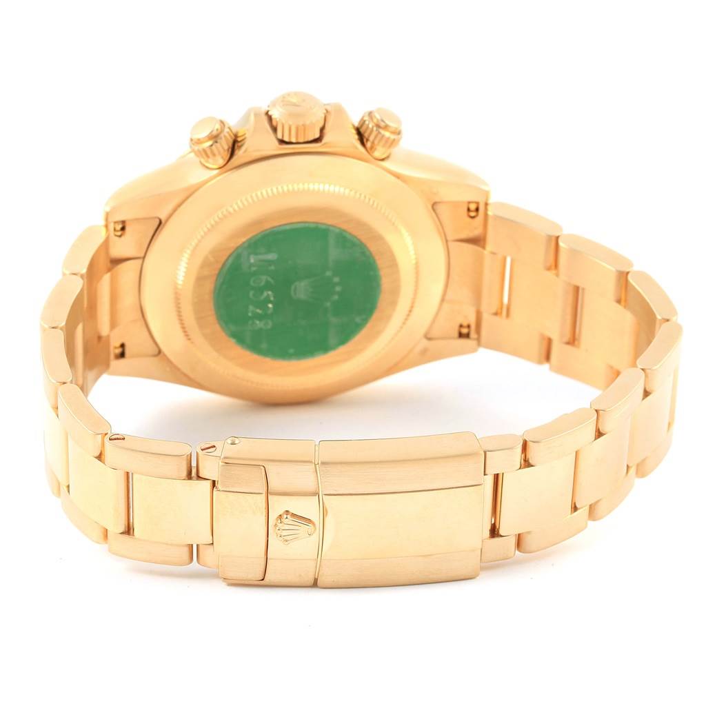 The image shows the back view of a Rolex Daytona 116528 Men's Yellow Gold Champagne Dial 116528 Men's Yellow Gold Champagne Dial watch, highlighting the bracelet, clasp, and case back.