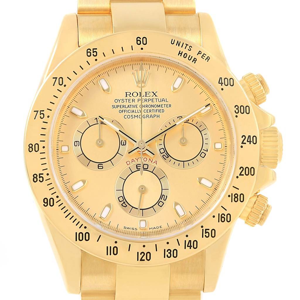 This image shows the face and bezel of a Rolex Daytona 116528 Men's Yellow Gold Champagne Dial 116528 Men's Yellow Gold Champagne Dial watch, viewed head-on, detailing the subdials and tachymeter scale.
