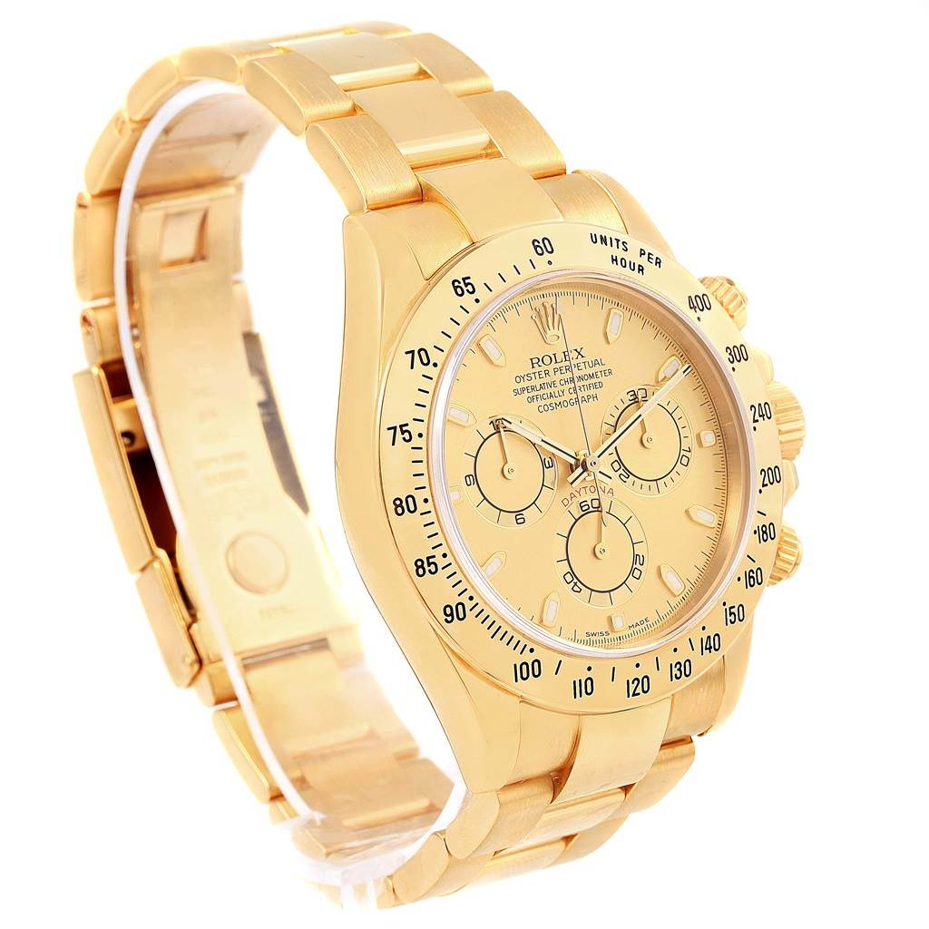 The image shows a Rolex Daytona 116528 Men's Yellow Gold Champagne Dial 116528 Men's Yellow Gold Champagne Dial watch at a slight angle, highlighting the face, bezel, crown, and partially opened bracelet.