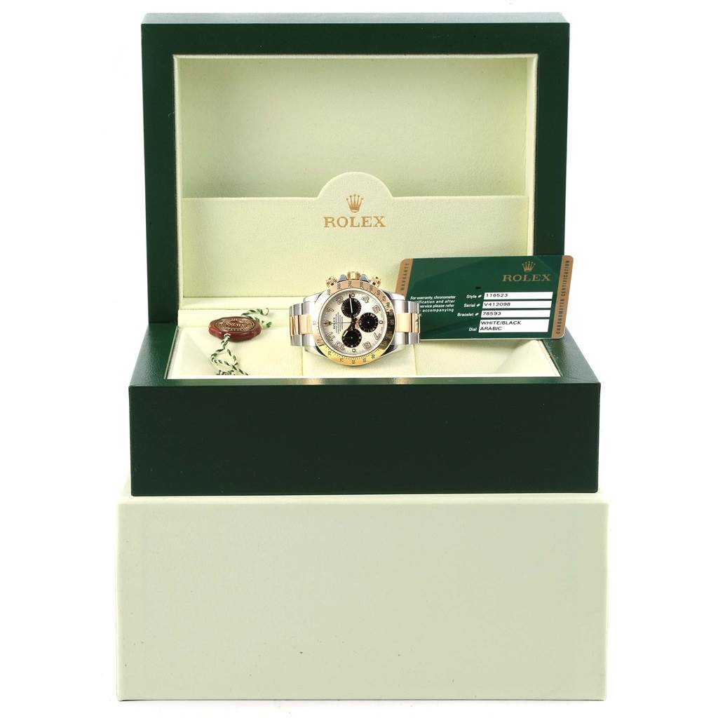 This image shows a Rolex Daytona 116523 Men's Steel and Gold (two tone) White Dial 116523 Men's Steel and Gold (two tone) White Dial watch in its box with accompanying documentation.
