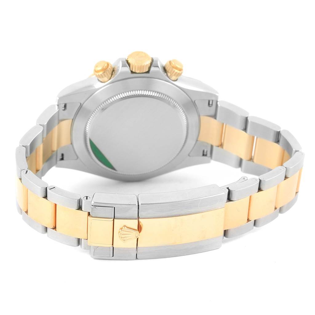 The image shows the back view of a Rolex Daytona 116523 Men's Steel and Gold (two tone) White Dial 116523 Men's Steel and Gold (two tone) White Dial watch, highlighting its two-tone bracelet and the closed clasp.