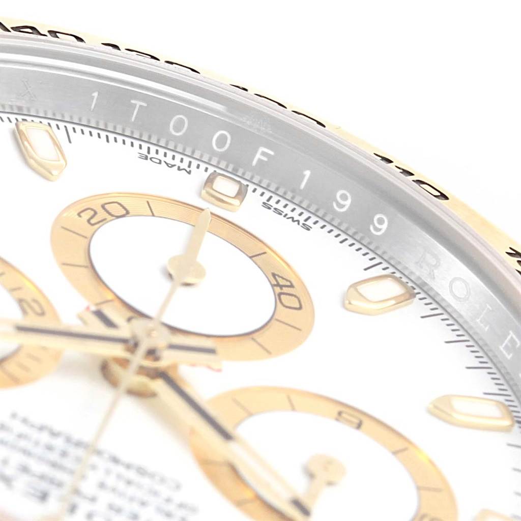 The image shows a close-up angle of the Rolex Daytona 116523 Men's Steel and Gold (two tone) White Dial 116523 Men's Steel and Gold (two tone) White Dial model watch, highlighting its dial, chronograph subdials, and partial bezel.
