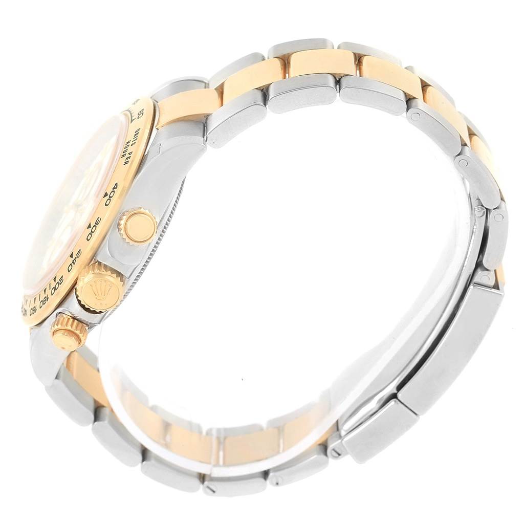 The image shows a side profile of a Rolex Daytona 116523 Men's Steel and Gold (two tone) White Dial 116523 Men's Steel and Gold (two tone) White Dial watch, highlighting the bracelet and crown.