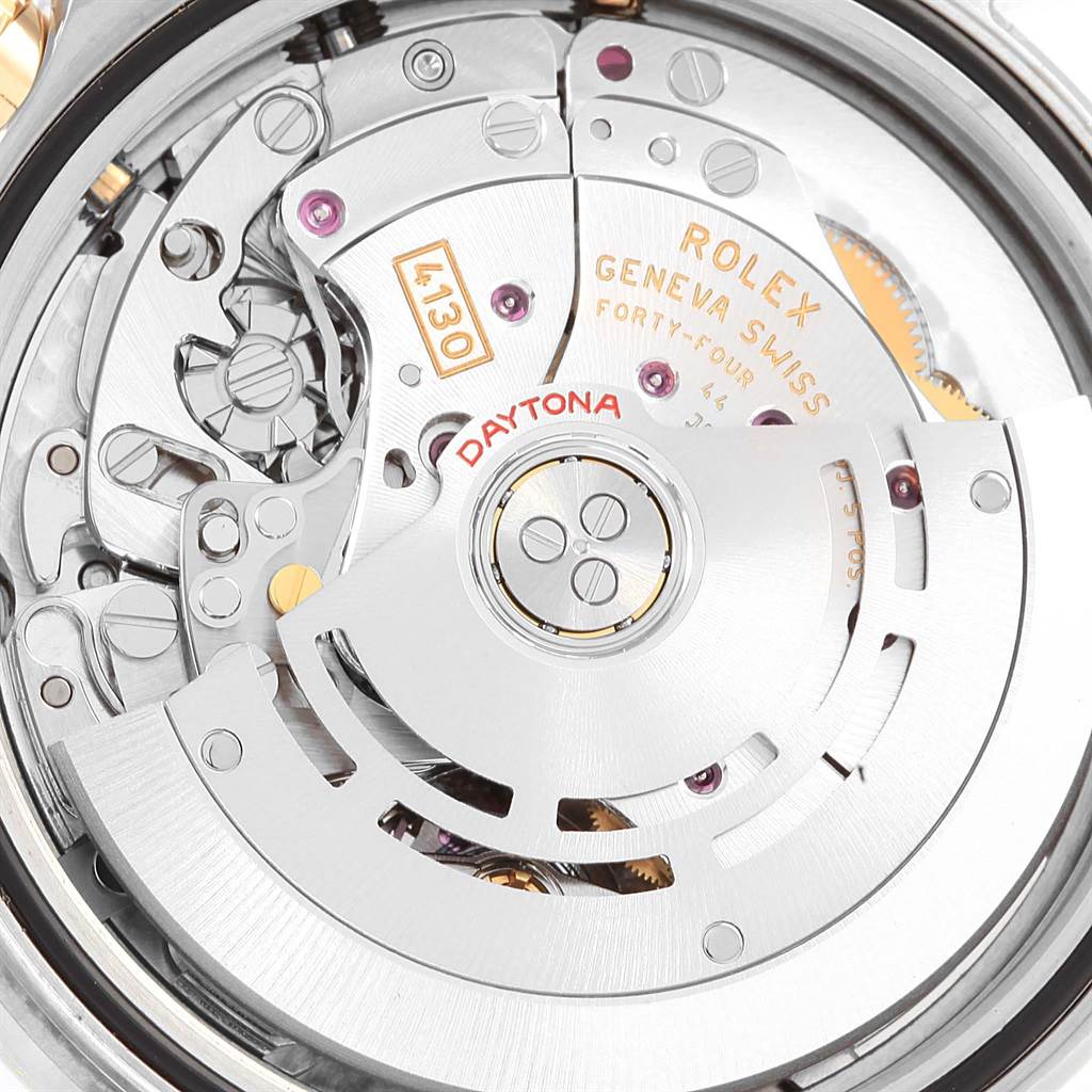 This image shows a close-up of the movement mechanism of a Rolex Daytona 116523 Men's Steel and Gold (two tone) Grey Dial 116523 Men's Steel and Gold (two tone) Grey Dial watch.