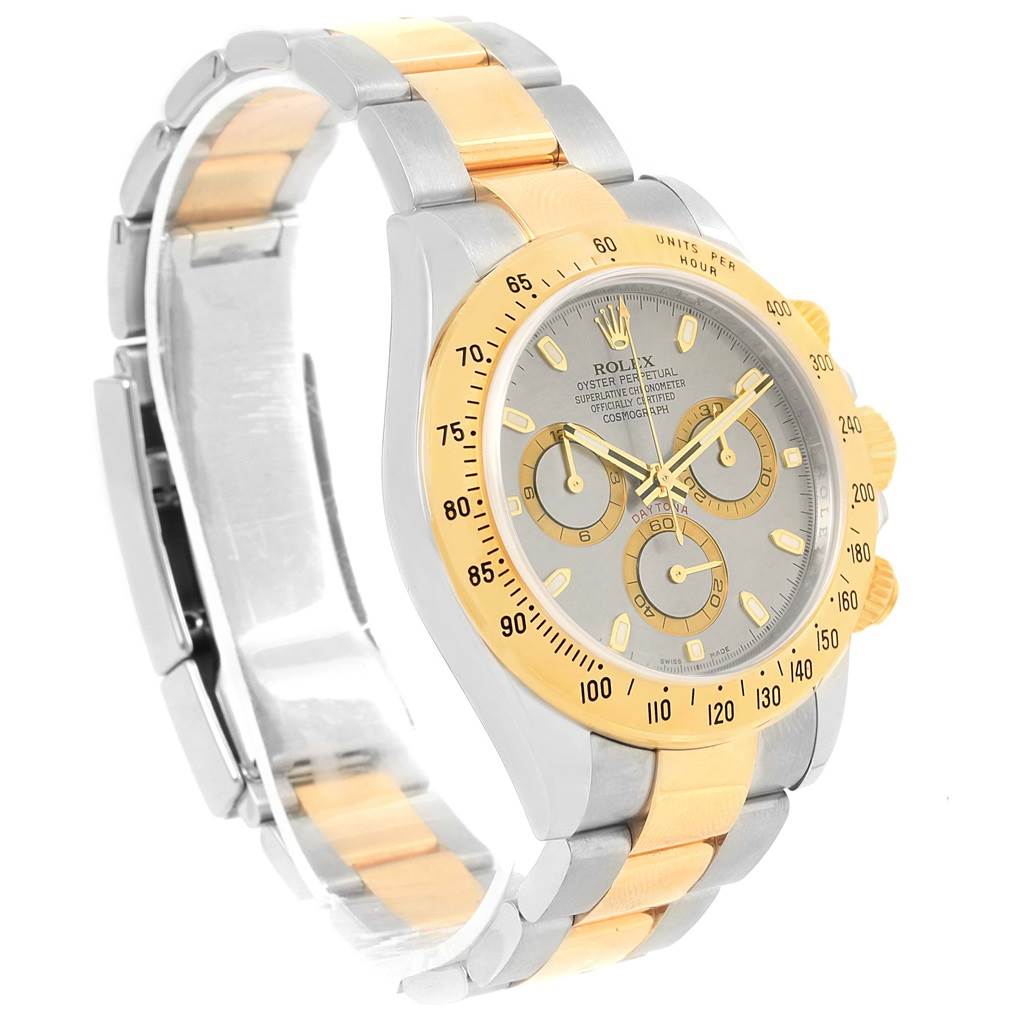 The image shows a Rolex Daytona 116523 Men's Steel and Gold (two tone) Grey Dial 116523 Men's Steel and Gold (two tone) Grey Dial watch angled to display the face, band, and clasp.