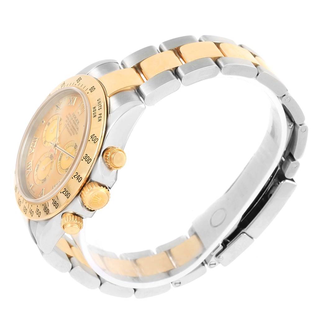 This image shows a side view of the Rolex Daytona 116523 Men's Steel and Gold (two tone) Mother of Pearl Dial 116523 Men's Steel and Gold (two tone) Mother of Pearl Dial watch, highlighting the crown, pushers, and two-tone metal bracelet.