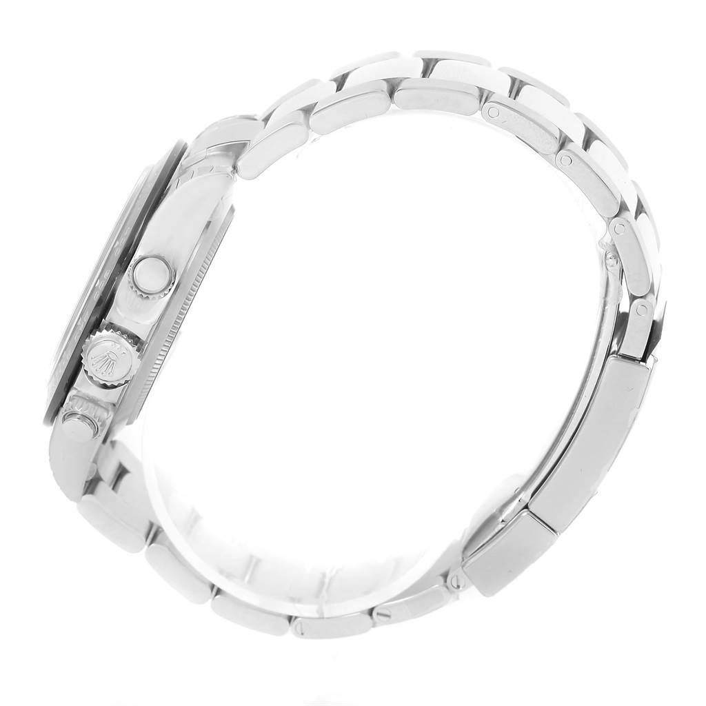 This side view of the Rolex Daytona 116500 Men's Stainless Steel White Dial 116500 Men's Stainless Steel White Dial watch showcases the crown, pushers, and bracelet.