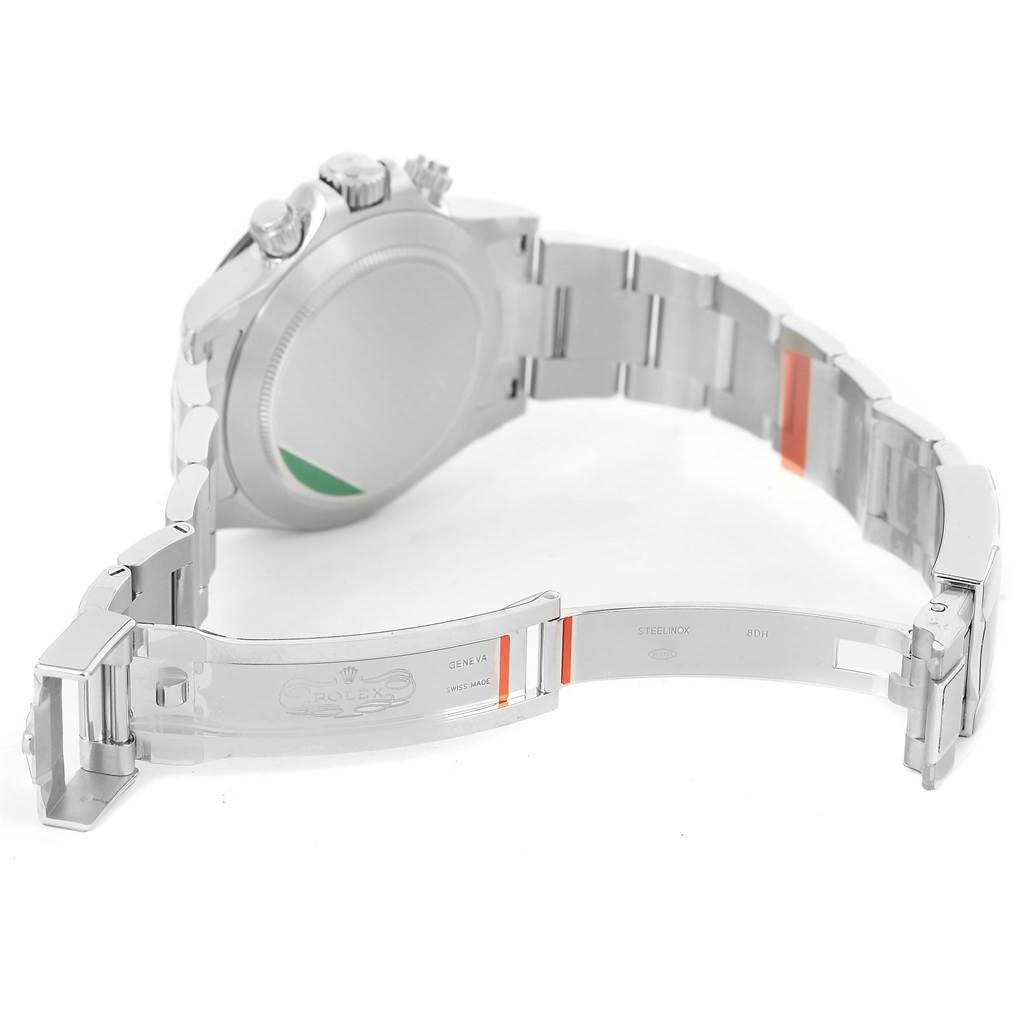 The image shows the backside and partially open clasp of a Rolex Daytona 116500 Men's Stainless Steel White Dial 116500 Men's Stainless Steel White Dial watch.