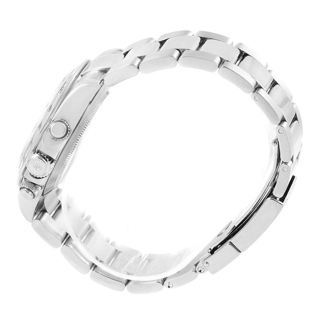 This image shows a side view of a Rolex Daytona 116520 Men's Stainless Steel Black Dial 116520 Men's Stainless Steel Black Dial watch, highlighting its bracelet, clasp, and side pushers.