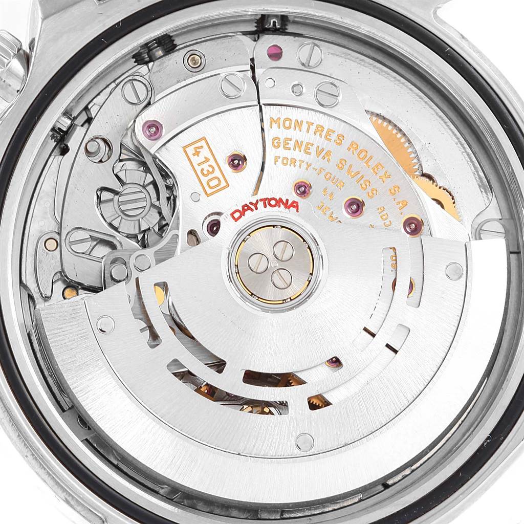 The image shows the internal mechanism of a Rolex Daytona 116520 Men's Stainless Steel Black Dial 116520 Men's Stainless Steel Black Dial watch, highlighting the movement and rotor parts.