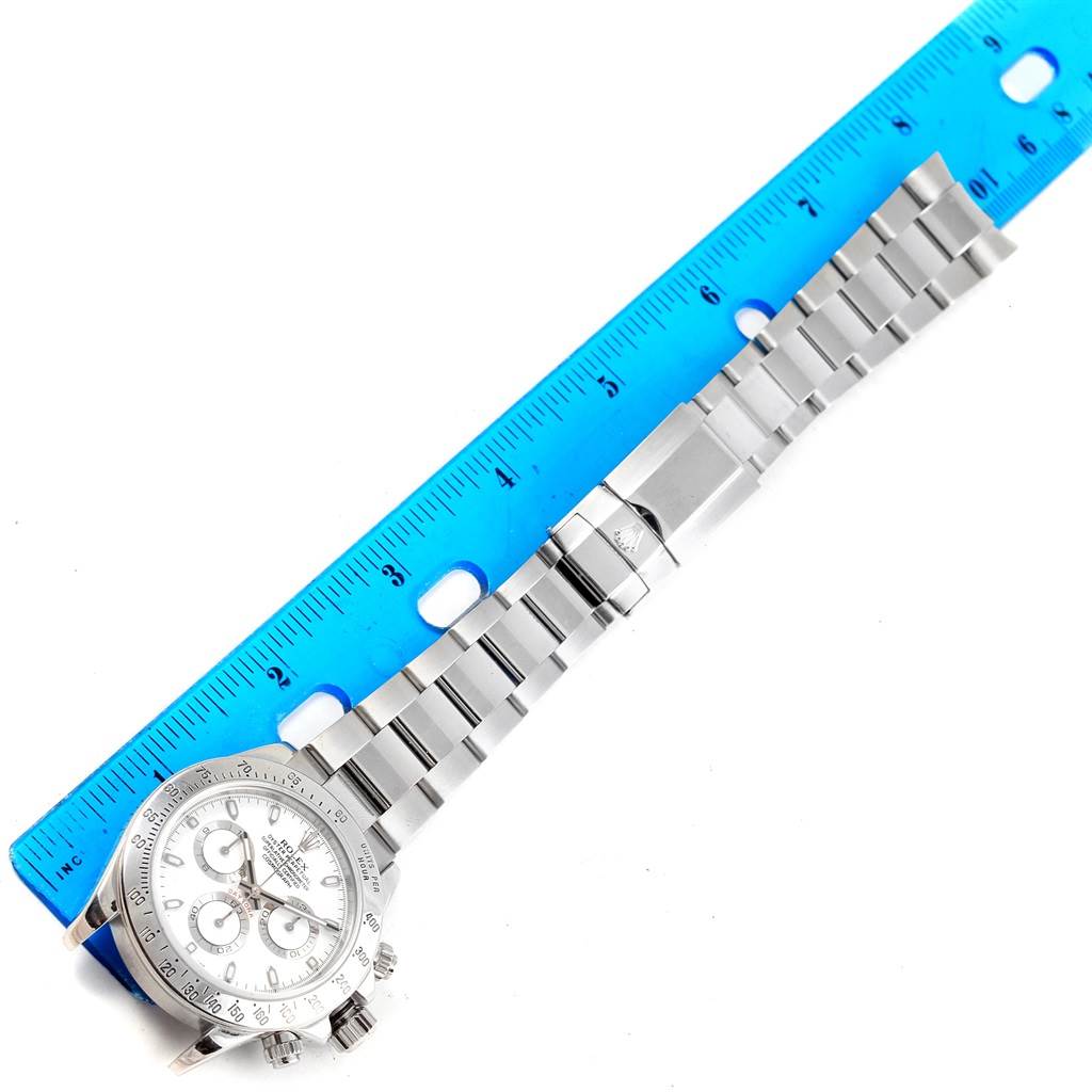 This Rolex Daytona 116520 Men's Stainless Steel White Dial 116520 Men's Stainless Steel White Dial watch is shown from a top-down angle, highlighting the stainless steel bracelet and tachymeter bezel.