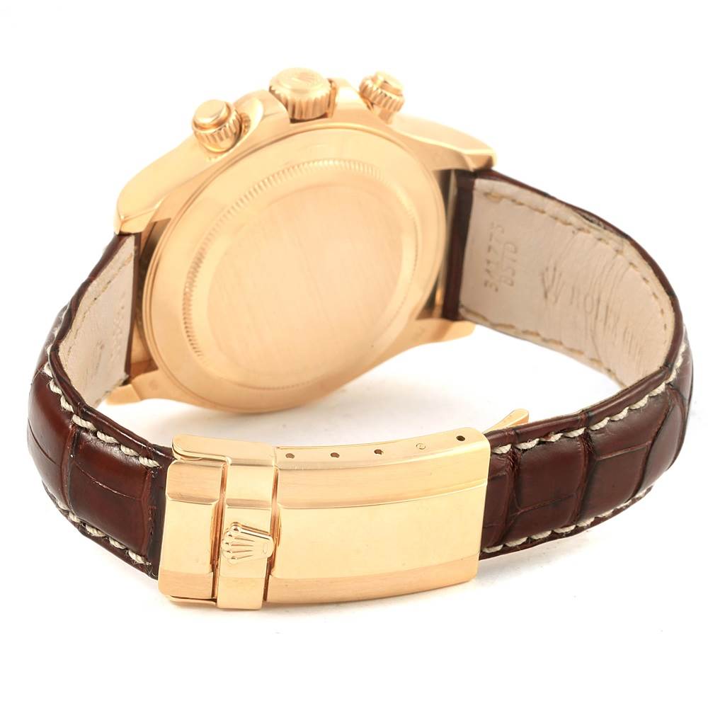 This image shows the back case and clasp of a Rolex Daytona 116518 Men's Stainless Steel Mother of Pearl Dial 116518 Men's Stainless Steel Mother of Pearl Dial watch, highlighting its leather strap and gold detailing.