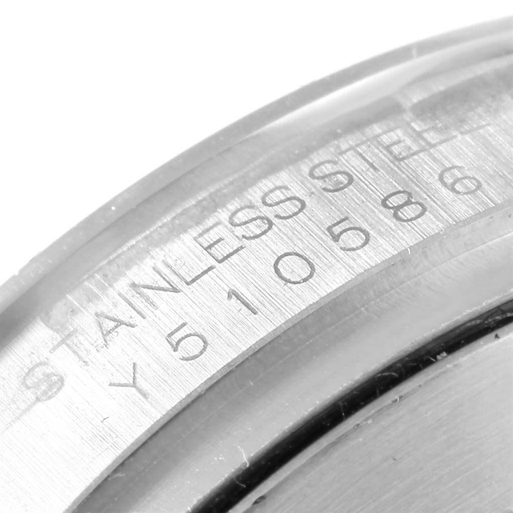 This image shows a close-up of the engraved serial number and "Stainless Steel" inscription on the case back of a Rolex Daytona 116520 Men's Stainless Steel Black Dial 116520 Men's Stainless Steel Black Dial watch.