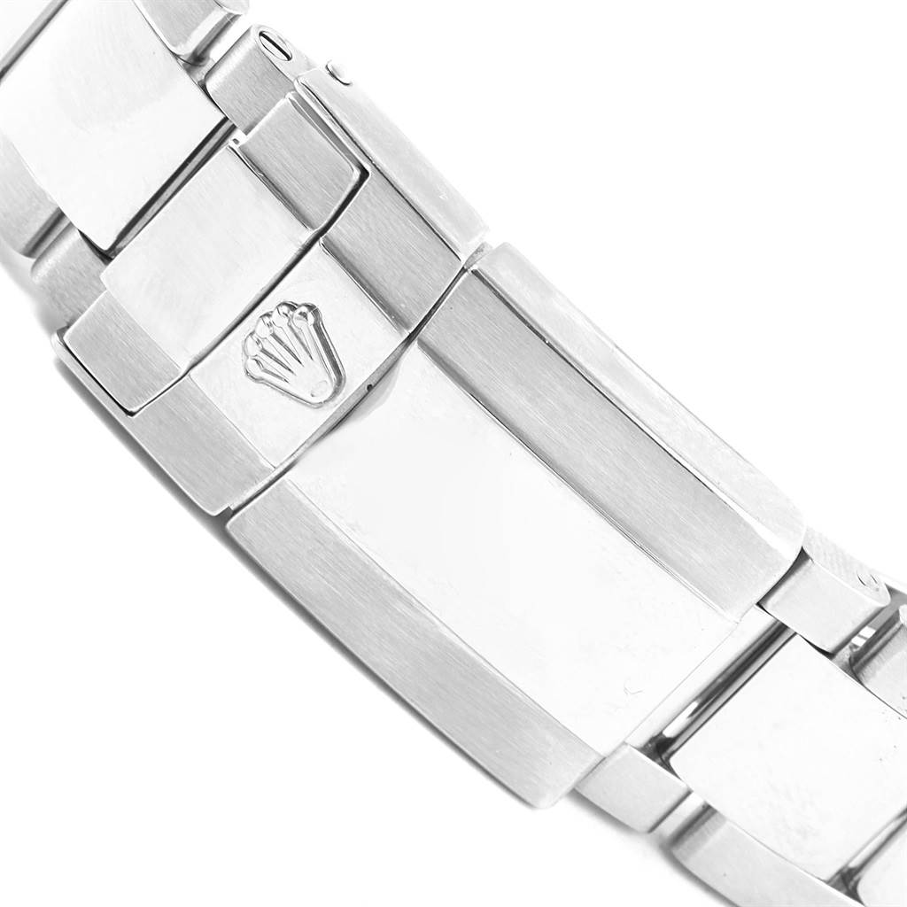 The image shows a close-up of the clasp and bracelet of a Rolex Daytona 116520 Men's Stainless Steel Black Dial 116520 Men's Stainless Steel Black Dial watch.