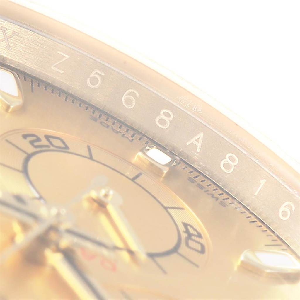 The image shows a close-up angled view of the dial and part of the bezel of a Rolex Daytona 116523 Men's Steel and Gold (two tone) Champagne Dial 116523 Men's Steel and Gold (two tone) Champagne Dial watch.