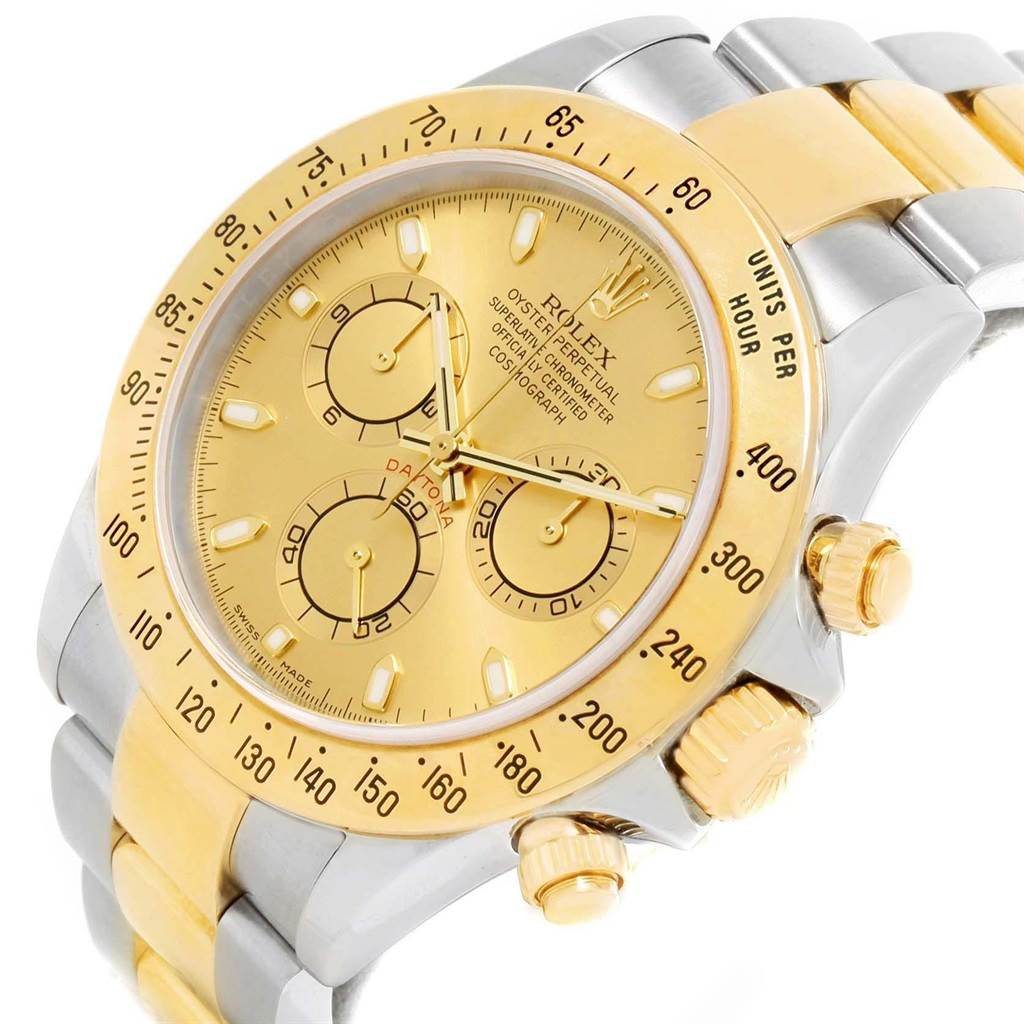 The Rolex Daytona 116523 Men's Steel and Gold (two tone) Champagne Dial 116523 Men's Steel and Gold (two tone) Champagne Dial watch shown is at an angled close-up, highlighting the dial, bezel, crown, and part of the bracelet.