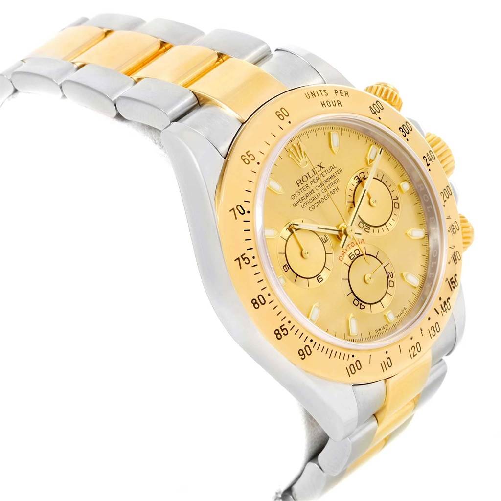 The Rolex Daytona 116523 Men's Steel and Gold (two tone) Champagne Dial 116523 Men's Steel and Gold (two tone) Champagne Dial watch is shown at an angled side view, displaying the bezel, dial, pushers, and a portion of the bracelet.