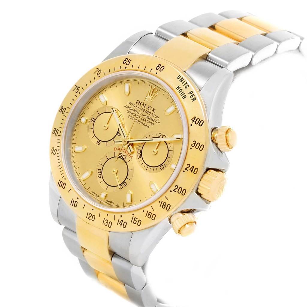 The image shows a Rolex Daytona 116523 Men's Steel and Gold (two tone) Champagne Dial 116523 Men's Steel and Gold (two tone) Champagne Dial watch at a three-quarter angle, highlighting its gold dial, bezel, and two-tone bracelet.