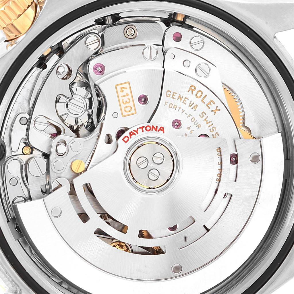 This image shows the movement and inner mechanism parts of a Rolex Daytona 116523 Men's Steel and Gold (two tone) Champagne Dial 116523 Men's Steel and Gold (two tone) Champagne Dial watch from a rear angle.
