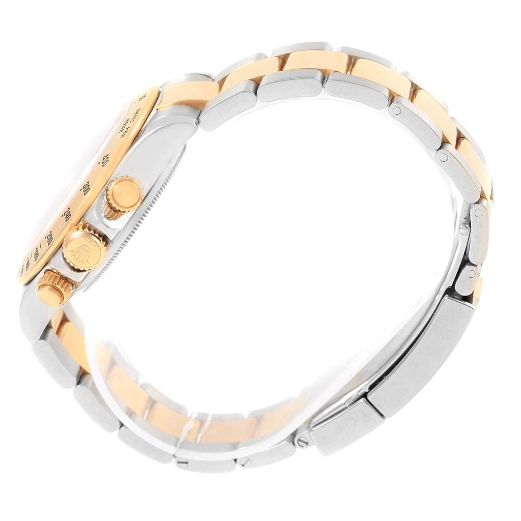 This image shows a side view of a Rolex Daytona 116523 Men's Steel and Gold (two tone) Black Dial 116523 Men's Steel and Gold (two tone) Black Dial watch, highlighting the bracelet and side buttons.