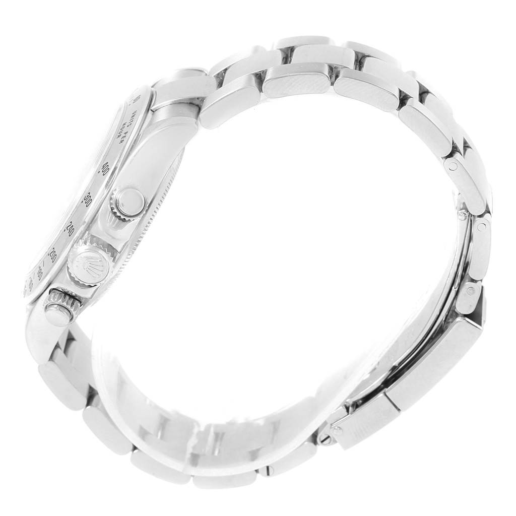 This side view of a Rolex Daytona 116520 Men's Stainless Steel Black Dial 116520 Men's Stainless Steel Black Dial watch shows the case, crown, pushers, and linked bracelet.