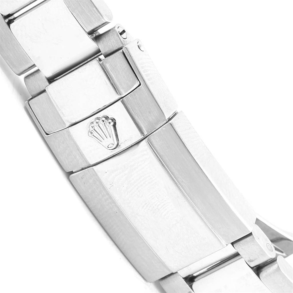 This image shows a close-up of the clasp and links of the bracelet of a Rolex Daytona 116520 Men's Stainless Steel Black Dial 116520 Men's Stainless Steel Black Dial watch, featuring the Rolex crown logo.