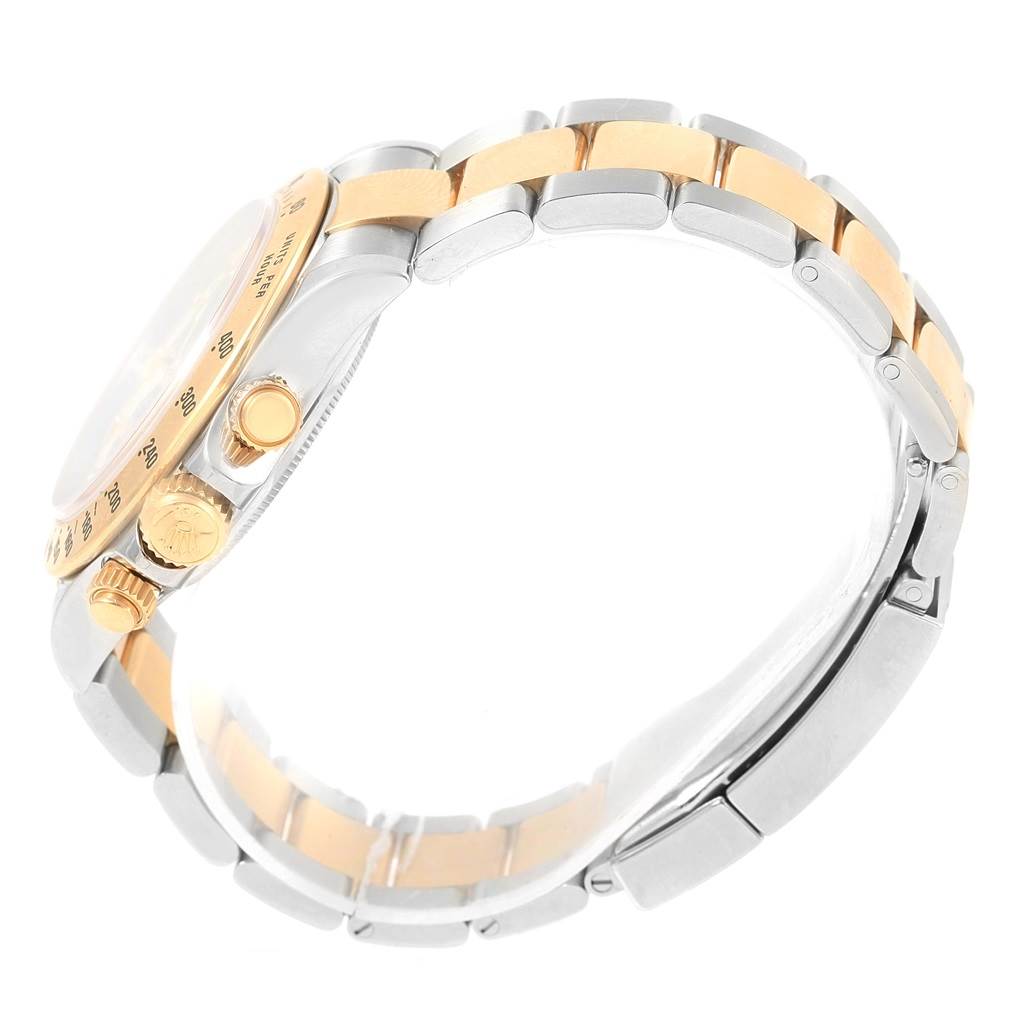 The image shows a side view of a Rolex Daytona 116523 Men's Steel and Gold (two tone) White Dial 116523 Men's Steel and Gold (two tone) White Dial watch, highlighting its case, crown, and two-tone bracelet.