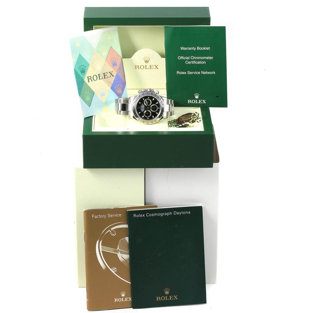 The image shows a Rolex Daytona 116520 Men's Stainless Steel Black Dial 116520 Men's Stainless Steel Black Dial watch from a front angle, along with its box, warranty booklet, certification, and service booklets.