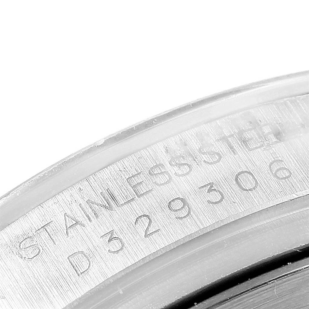 This close-up image shows the engraved serial number on a stainless steel part of a Rolex Daytona 116520 Men's Stainless Steel Black Dial 116520 Men's Stainless Steel Black Dial watch.